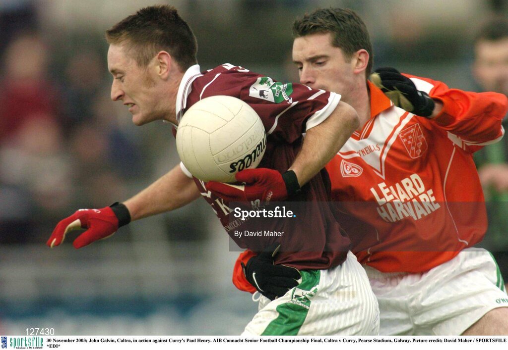 30 November 2003; John Galvin, Caltra, in action against Curry's Paul Henry. AIB Connacht Senior Football Championship Final, Caltra v Curry, Pearse Stadium, Galway. Picture credit; David Maher / SPORTSFILE *EDI*