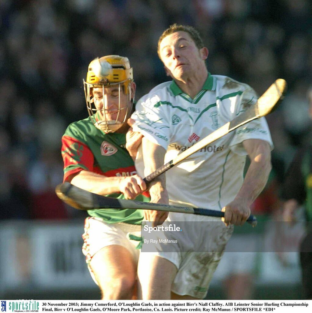 30 November 2003; Jimmy Comerford, O'Loughlin Gaels, in action against Birr's Niall Claffey. AIB Leinster Senior Hurling Championship Final, Birr v O'Loughlin Gaels, O'Moore Park, Portlaoise, Co. Laois. Picture credit; Ray McManus / SPORTSFILE *EDI*