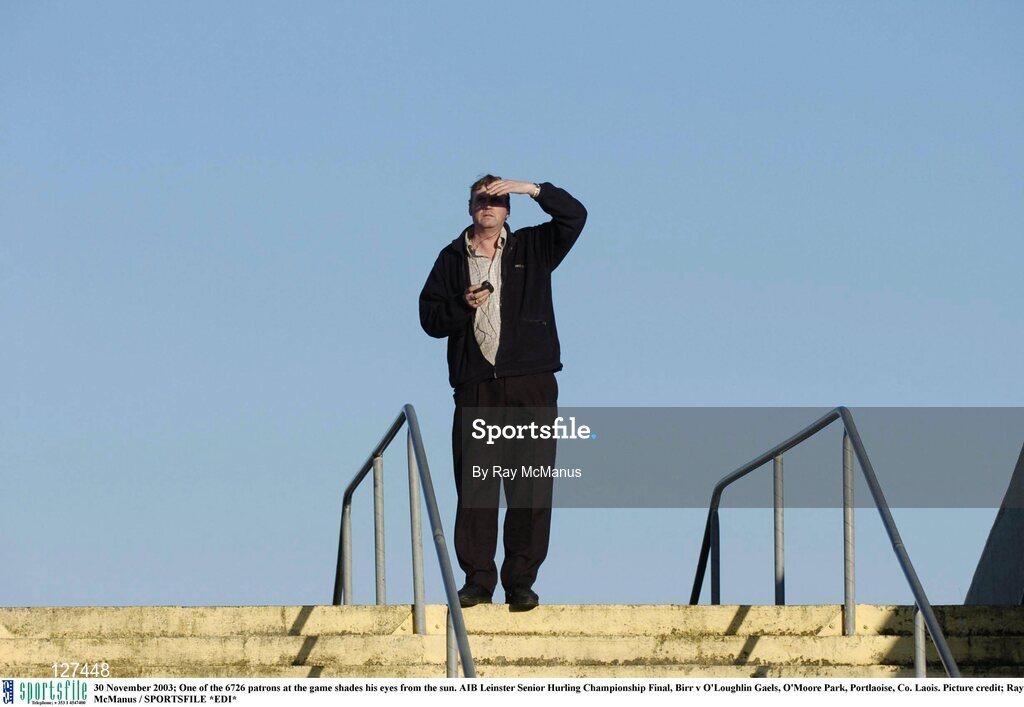 30 November 2003; One of the 6726 patrons at the game shades his eyes from the sun. AIB Leinster Senior Hurling Championship Final, Birr v O'Loughlin Gaels, O'Moore Park, Portlaoise, Co. Laois. Picture credit; Ray McManus / SPORTSFILE *EDI*