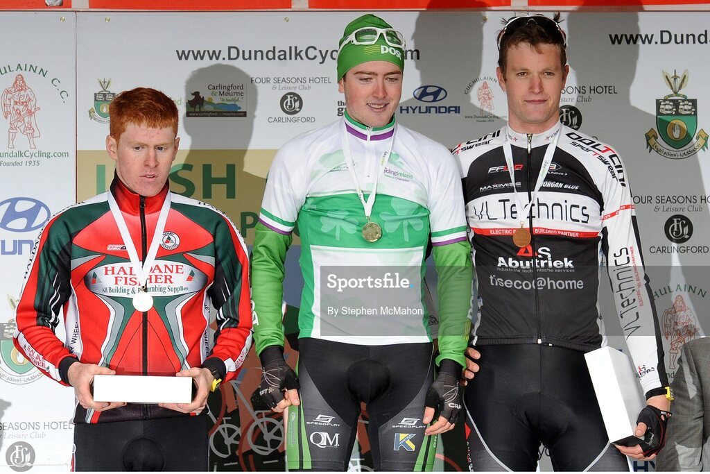 23 June 2013; Cormac Clarke, Newry Wheelers, left, second place, celebrates with race winner Jack Wilson, An Post Sean Kelly Chainreaction Team, and third place Conor Dunne, Vl Technics – Abutriek, on the awards podium at the U23 Men's Road Race National Championships. National Road Race Championships, Carlingford, Co. Louth. Picture credit: Stephen McMahon / SPORTSFILE