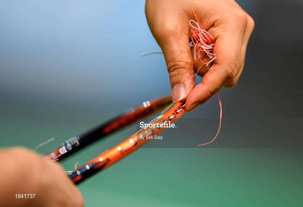 15 November 2019; A competitor unstrings a racket prior to the AIG FZ Forza Irish Open Badminton Championships at the National Indoor Arena in Abbotstown, Dublin. Photo by Seb Daly/Sportsfile