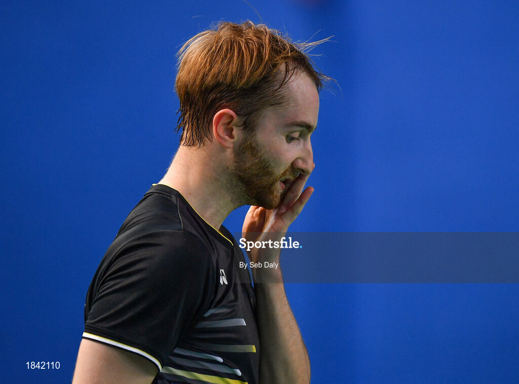 15 November 2019; Sam Magee of Ireland reacts after losing a point during his mixed doubles semi-final match against Anne Tran and Ronan Labar of France at the AIG FZ Forza Irish Open Badminton Championships at the National Indoor Arena in Abbotstown, Dublin. Photo by Seb Daly/Sportsfile
