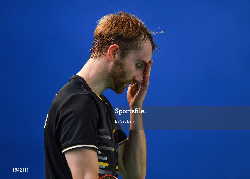 15 November 2019; Sam Magee of Ireland reacts after losing a point during his mixed doubles semi-final match against Anne Tran and Ronan Labar of France at the AIG FZ Forza Irish Open Badminton Championships at the National Indoor Arena in Abbotstown, Dublin. Photo by Seb Daly/Sportsfile