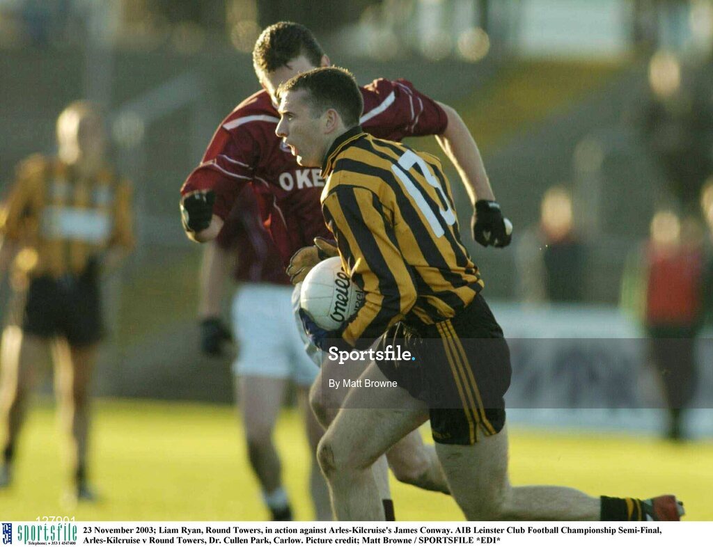 23 November 2003; Liam Ryan, Round Towers, in action against Arles-Kilcruise's James Conway. AIB Leinster Club Football Championship Semi-Final, Arles-Kilcruise v Round Towers, Dr. Cullen Park, Carlow. Picture credit; Matt Browne / SPORTSFILE *EDI*