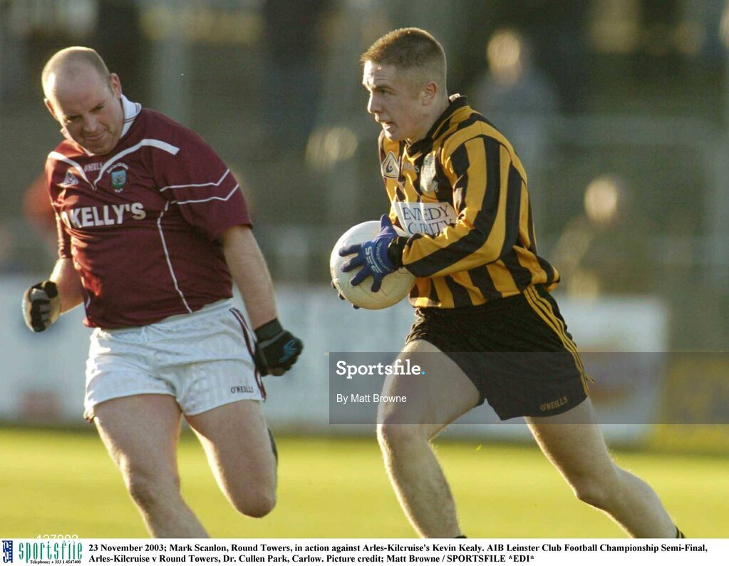 23 November 2003; Mark Scanlon, Round Towers, in action against Arles-Kilcruise's Kevin Kealy. AIB Leinster Club Football Championship Semi-Final, Arles-Kilcruise v Round Towers, Dr. Cullen Park, Carlow. Picture credit; Matt Browne / SPORTSFILE *EDI*