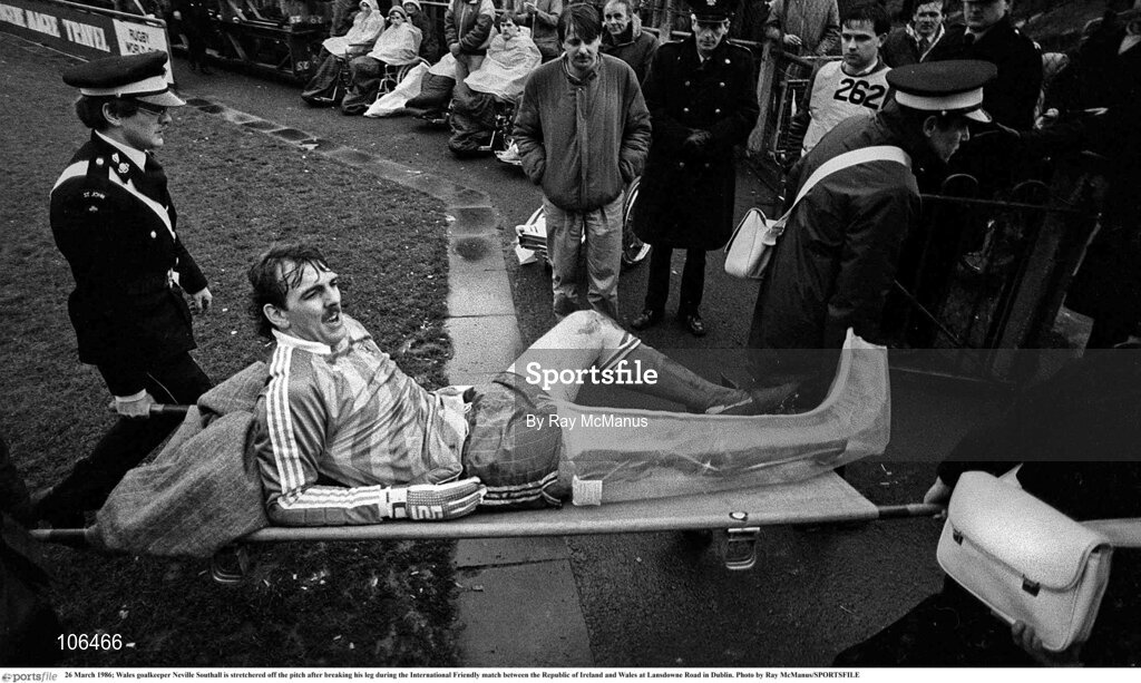 26 March 1986; Wales goalkeeper Neville Southall is stretchered off the pitch after breaking his leg during the International Friendly match between the Republic of Ireland and Wales at Lansdowne Road in Dublin. Photo by Ray McManus/SPORTSFILE