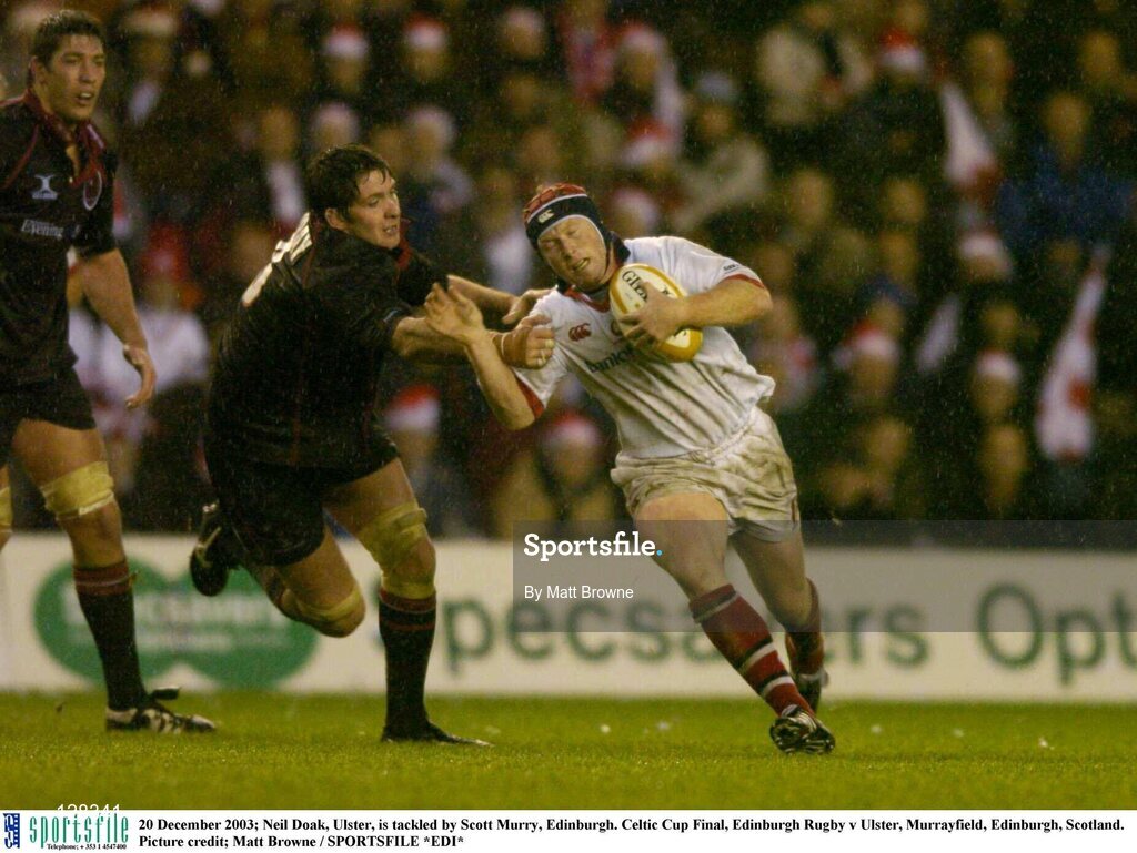20 December 2003; Neil Doak, Ulster, is tackled by Scott Murry, Edinburgh. Celtic Cup Final, Edinburgh Rugby v Ulster, Murrayfield, Edinburgh, Scotland. Picture credit; Matt Browne / SPORTSFILE *EDI*