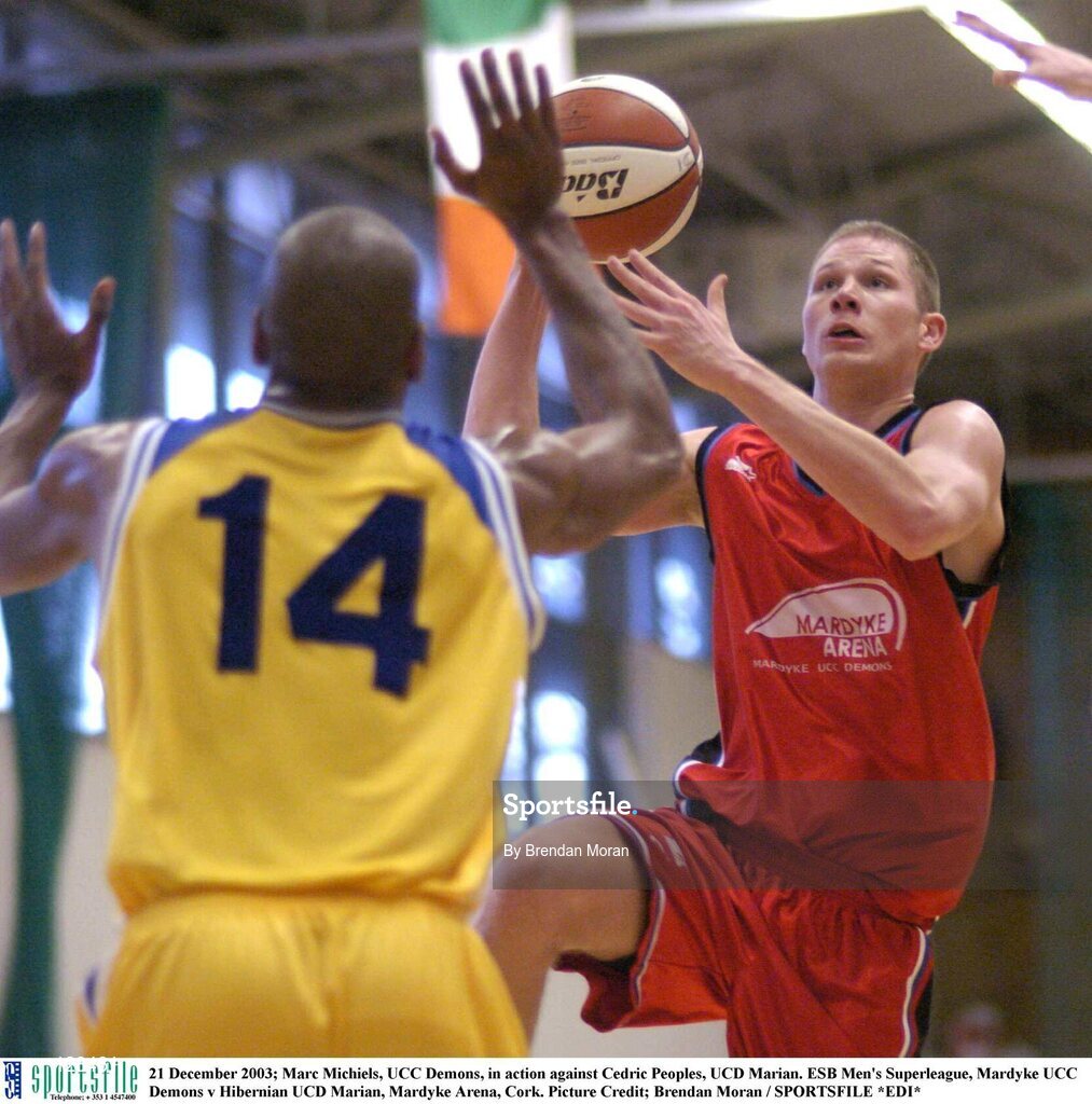 21 December 2003; Marc Michiels, UCC Demons, in action against Cedric Peoples, UCD Marian. ESB Men's Superleague, Mardyke UCC Demons v Hibernian UCD Marian, Mardyke Arena, Cork. Picture Credit; Brendan Moran / SPORTSFILE *EDI*