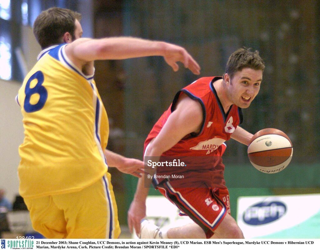 21 December 2003; Shane Coughlan, UCC Demons, in action against Kevin Meaney (8), UCD Marian. ESB Men's Superleague, Mardyke UCC Demons v Hibernian UCD Marian, Mardyke Arena, Cork. Picture Credit; Brendan Moran / SPORTSFILE *EDI*