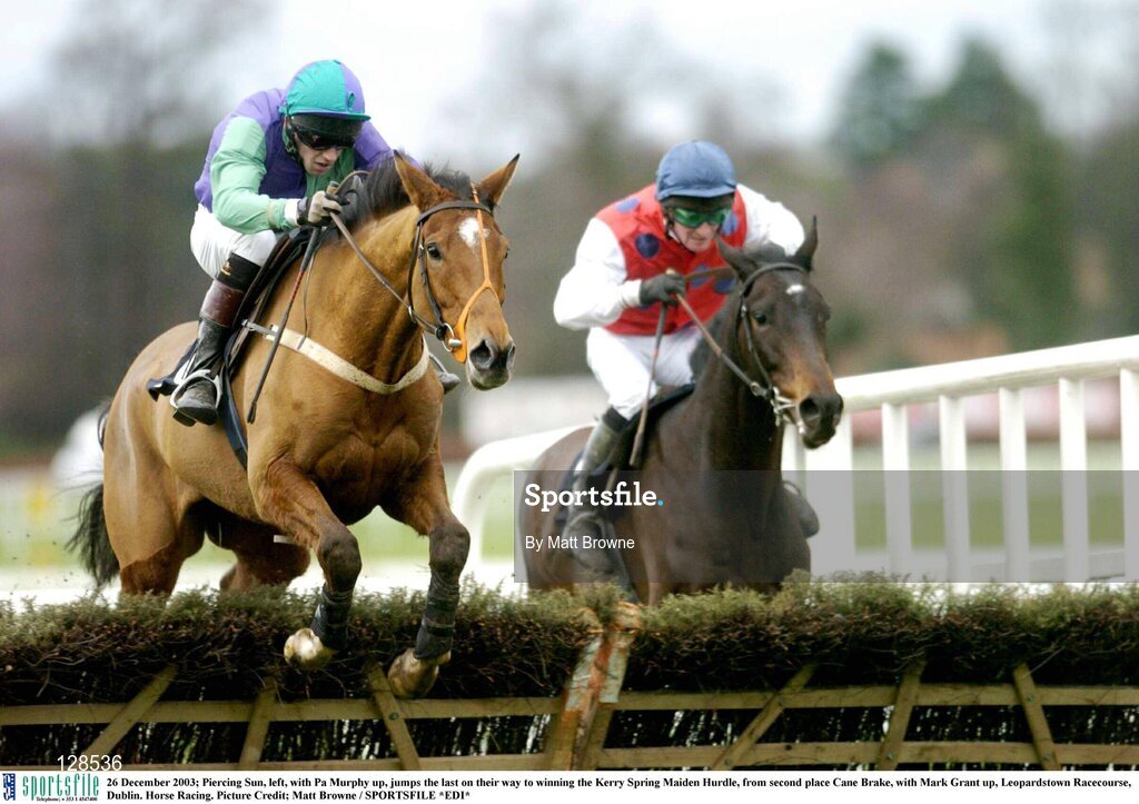 26 December 2003; Piercing Sun, left, with Pa Murphy up, jumps the last on their way to winning the Kerry Spring Maiden Hurdle, from second place Cane Brake, with Mark Grant up, Leopardstown Racecourse, Dublin. Horse Racing. Picture Credit; Matt Browne / SPORTSFILE *EDI*