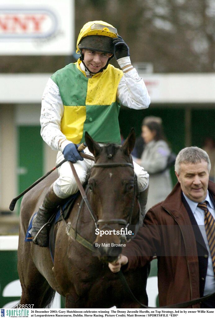 26 December 2003; Gary Hutchinson celebrates winning  The Denny Juvenile Hurdle, on Top Strategy, led in by owner Willie Kane at Leopardstown Racecourse, Dublin. Horse Racing. Picture Credit; Matt Browne / SPORTSFILE *EDI*