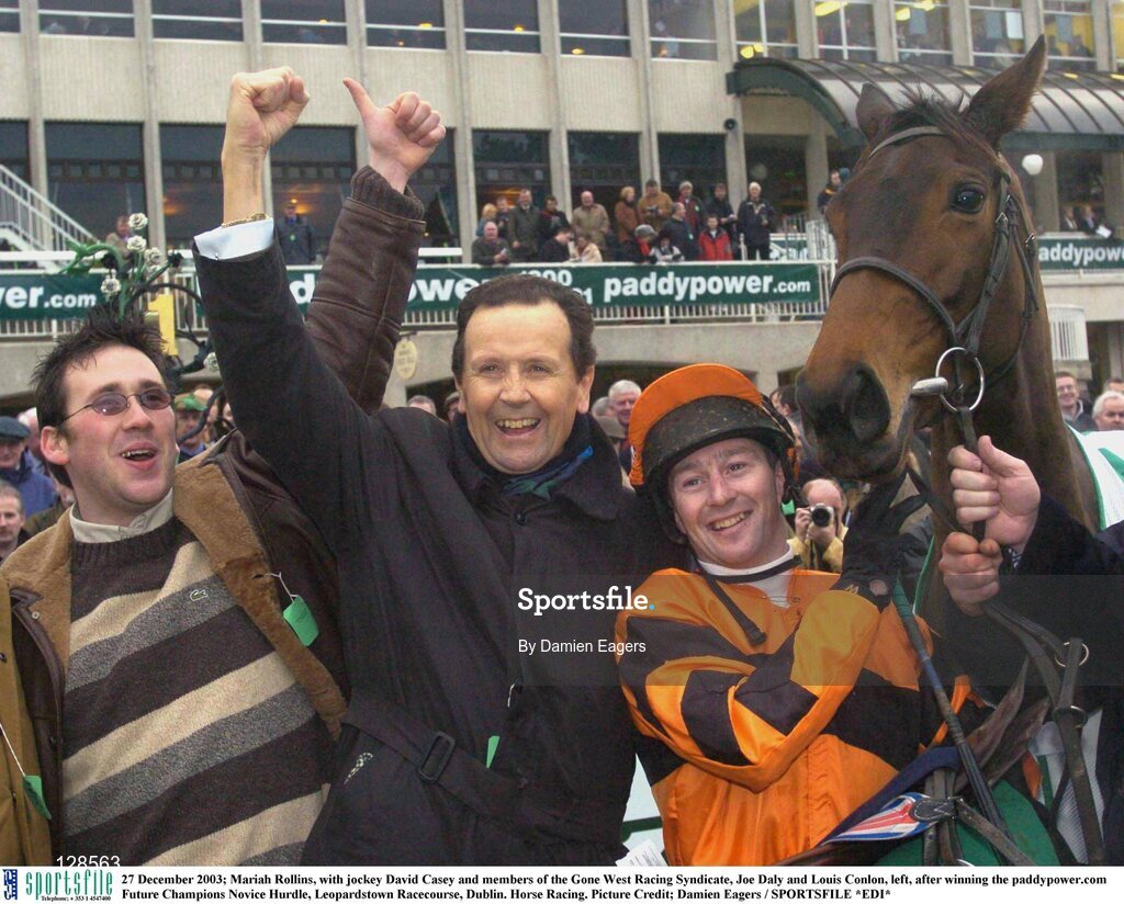 27 December 2003; Mariah Rollins, with jockey David Casey and members of the Gone West Racing Syndicate, Joe Daly and Louis Conlon, left, after winning the paddypower.com Future Champions Novice Hurdle, Leopardstown Racecourse, Dublin. Horse Racing. Picture Credit; Damien Eagers / SPORTSFILE *EDI*