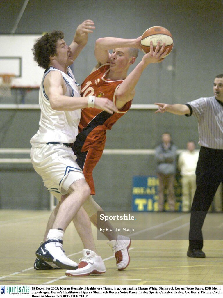 28 December 2003; Kieran Donaghy, Healthstore Tigers, in action against Ciaran White, Shamrock Rovers Notre Dame. ESB Men's Superleague, Horan's Healthstore Tigers v Shamrock Rovers Notre Dame, Tralee Sports Complex, Tralee, Co. Kerry. Picture Credit; Brendan Moran / SPORTSFILE *EDI*