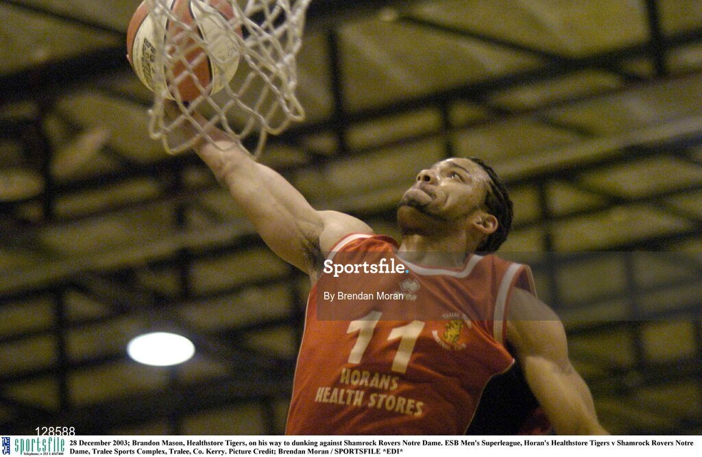28 December 2003; Brandon Mason, Healthstore Tigers, on his way to dunking against Shamrock Rovers Notre Dame. ESB Men's Superleague, Horan's Healthstore Tigers v Shamrock Rovers Notre Dame, Tralee Sports Complex, Tralee, Co. Kerry. Picture Credit; Brendan Moran / SPORTSFILE *EDI*