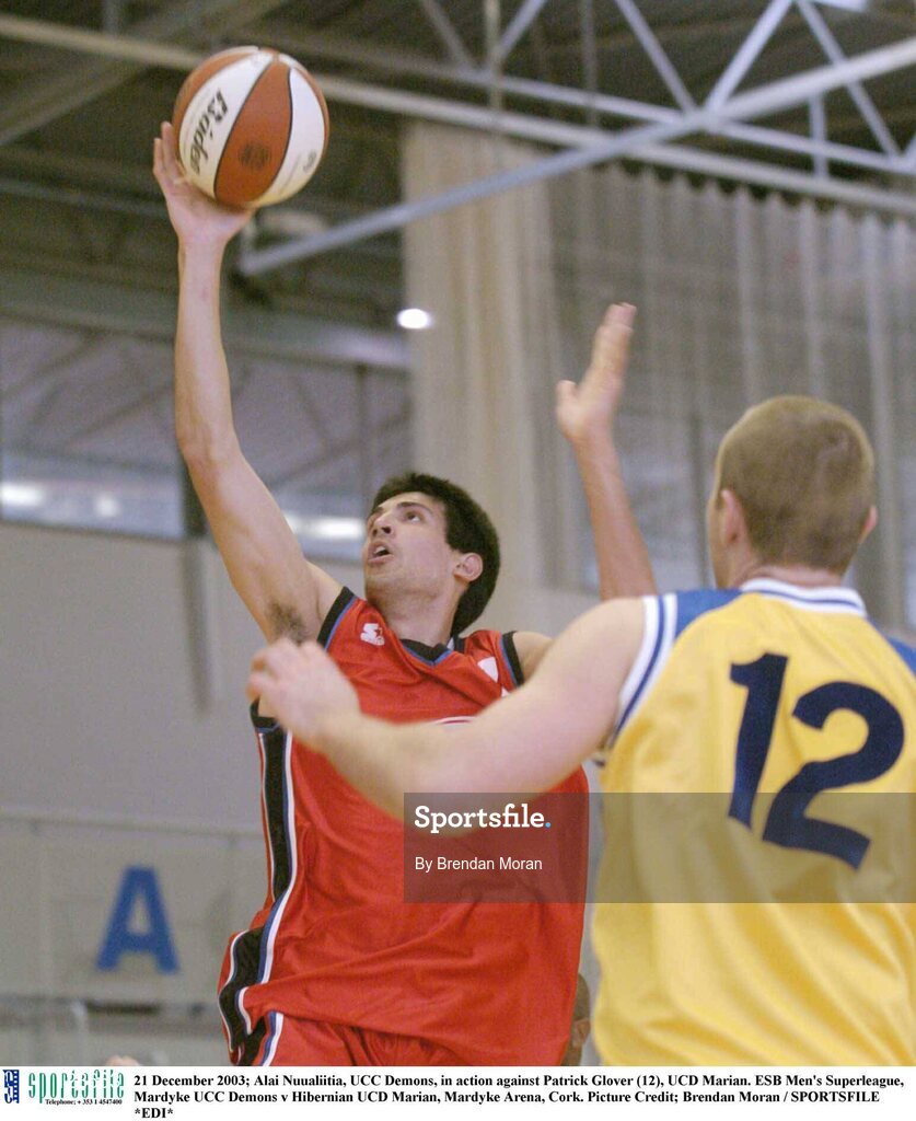 21 December 2003; Alai Nuualiitia, UCC Demons, in action against Patrick Glover (12), UCD Marian. ESB Men's Superleague, Mardyke UCC Demons v Hibernian UCD Marian, Mardyke Arena, Cork. Picture Credit; Brendan Moran / SPORTSFILE *EDI*
