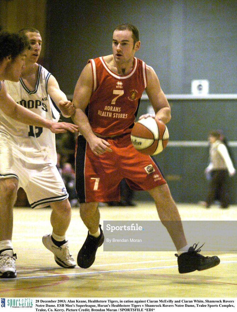 28 December 2003; Alan Keane, Healthstore Tigers, in cation against Ciaran McEvilly and Ciaran White, Shamrock Rovers Notre Dame. ESB Men's Superleague, Horan's Healthstore Tigers v Shamrock Rovers Notre Dame, Tralee Sports Complex, Tralee, Co. Kerry. Picture Credit; Brendan Moran / SPORTSFILE *EDI*