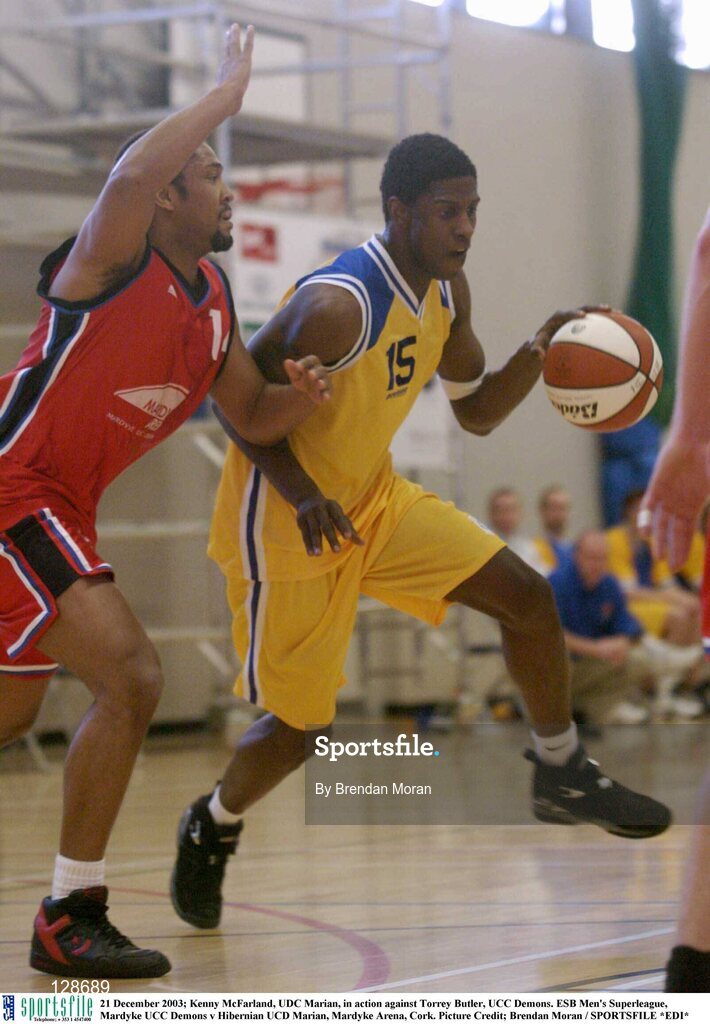 21 December 2003; Kenny McFarland, UDC Marian, in action against Torrey Butler, UCC Demons. ESB Men's Superleague, Mardyke UCC Demons v Hibernian UCD Marian, Mardyke Arena, Cork. Picture Credit; Brendan Moran / SPORTSFILE *EDI*