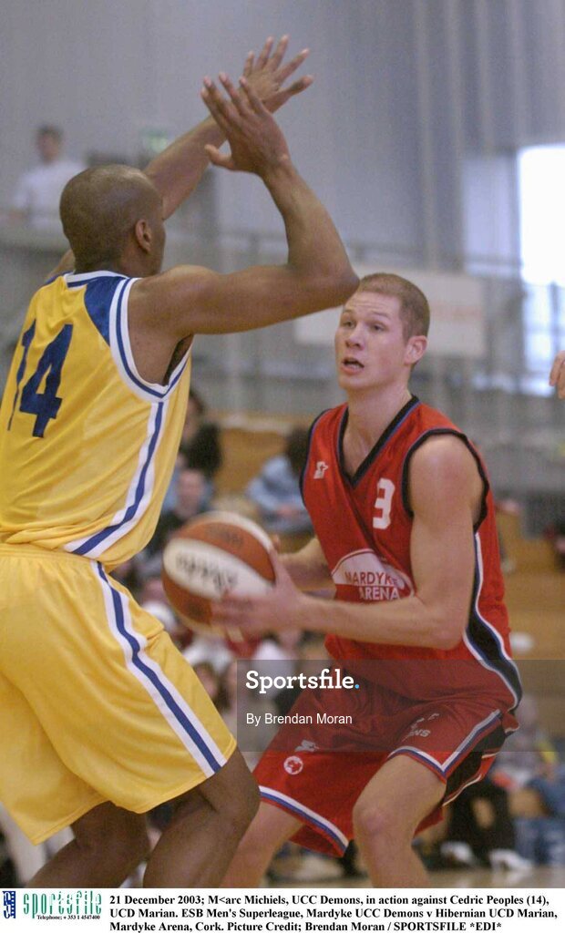 21 December 2003; M<arc Michiels, UCC Demons, in action against Cedric Peoples (14), UCD Marian. ESB Men's Superleague, Mardyke UCC Demons v Hibernian UCD Marian, Mardyke Arena, Cork. Picture Credit; Brendan Moran / SPORTSFILE *EDI*