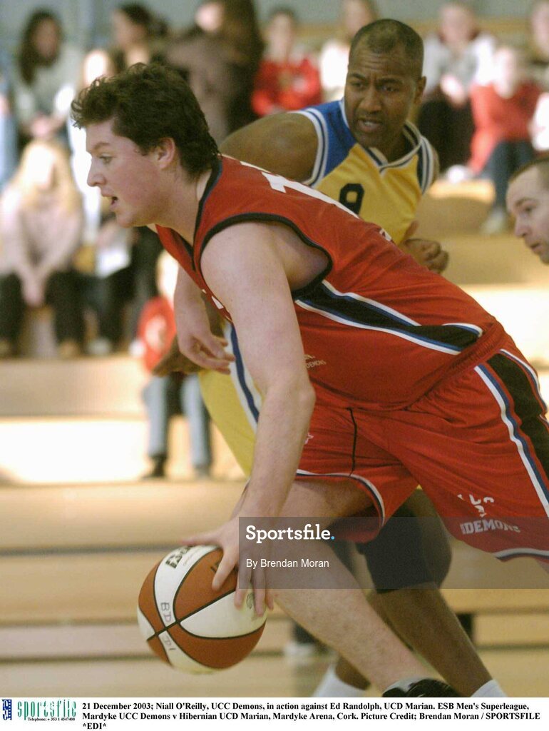 21 December 2003; Niall O'Reilly, UCC Demons, in action against Ed Randolph, UCD Marian. ESB Men's Superleague, Mardyke UCC Demons v Hibernian UCD Marian, Mardyke Arena, Cork. Picture Credit; Brendan Moran / SPORTSFILE *EDI*
