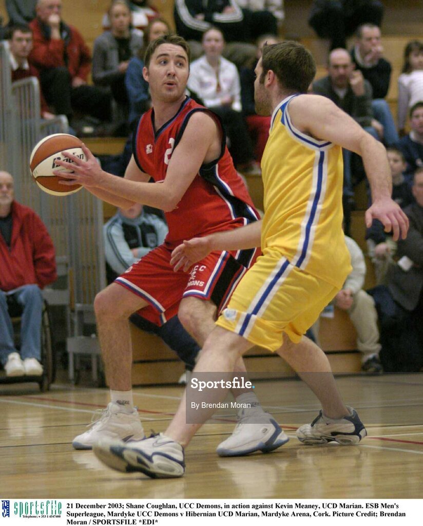 21 December 2003; Shane Coughlan, UCC Demons, in action against Kevin Meaney, UCD Marian. ESB Men's Superleague, Mardyke UCC Demons v Hibernian UCD Marian, Mardyke Arena, Cork. Picture Credit; Brendan Moran / SPORTSFILE *EDI*