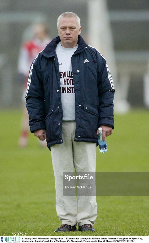 4 January 2004; Westmeath manager Paidi î SŽ stands for  Amhrán na bhFiann before the start of the game. O'Byrne Cup, Westmeath v Louth, Cusack Park, Mullingar, Co. Westmeath. Picture credit; Ray McManus / SPORTSFILE *EDI*