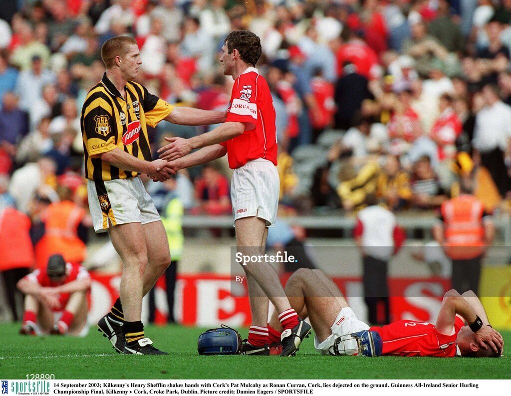 14 September 2003; Kilkenny's Henry Shefflin shakes hands with Cork's Pat Mulcahy as Ronan Curran, Cork, lies dejected on the ground. Guinness All-Ireland Senior Hurling Championship Final, Kilkenny v Cork, Croke Park, Dublin. Picture credit; Damien Eagers / SPORTSFILE
