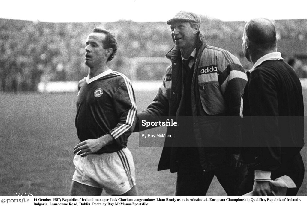 14 October 1987; Republic of Ireland manager Jack Charlton congratulates Liam Brady as he is substituted. European Championship Qualifier, Republic of Ireland v Bulgaria, Lansdowne Road, Dublin. Photo by Ray McManus/Sportsfile
