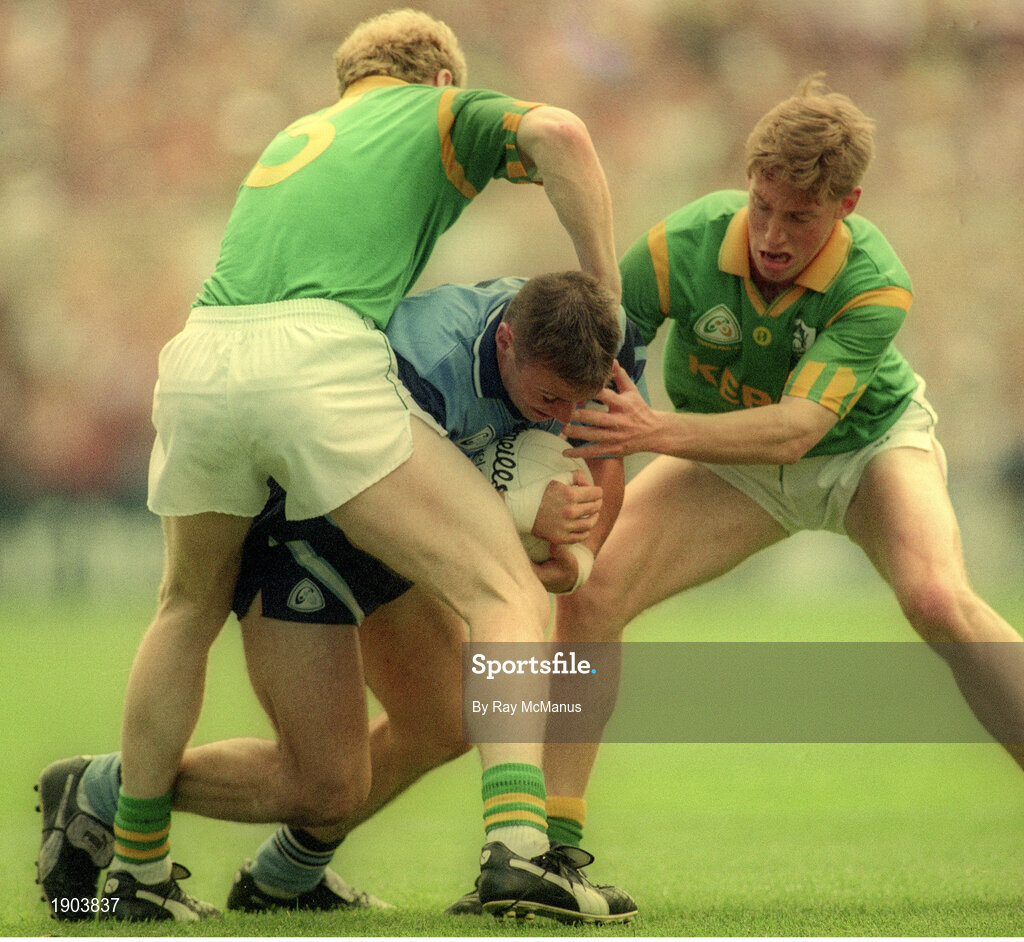 30 July 1995; Paul Curran of Dublin in action against John McDermott, left, and Trevor Giles of Meath during the Bank of Ireland Leinster Senior Football Championship Final match between Dublin and Meath at Croke Park in Dublin. Photo by Ray McManus/Sportsfile