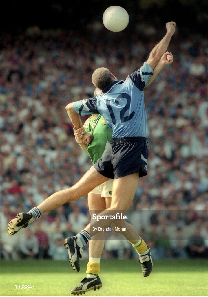 30 July 1995; Paul Clarke of Dublin scores his side's first goal despite the attempted tackle from Cormac Murphy of Meath during the Bank of Ireland Leinster Senior Football Championship Final match between Dublin and Meath at Croke Park in Dublin. Photo by Brendan Moran/Sportsfile