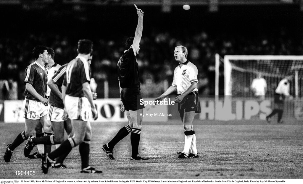11 June 1990; Steve McMahon of England is shown a yellow card by referee Aron Schmidhuber during the FIFA World Cup 1990 Group F match between England and Republic of Ireland at Stadio Sant'Elia in Cagliari, Italy. Photo by Ray McManus/Sportsfile