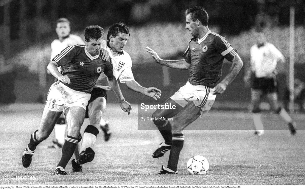 11 June 1990; Kevin Sheedy, left, and Mick McCarthy of Republic of Ireland in action against Peter Beardsley of England during the FIFA World Cup 1990 Group F match between England and Republic of Ireland at Stadio Sant'Elia in Cagliari, Italy. Photo by Ray McManus/Sportsfile