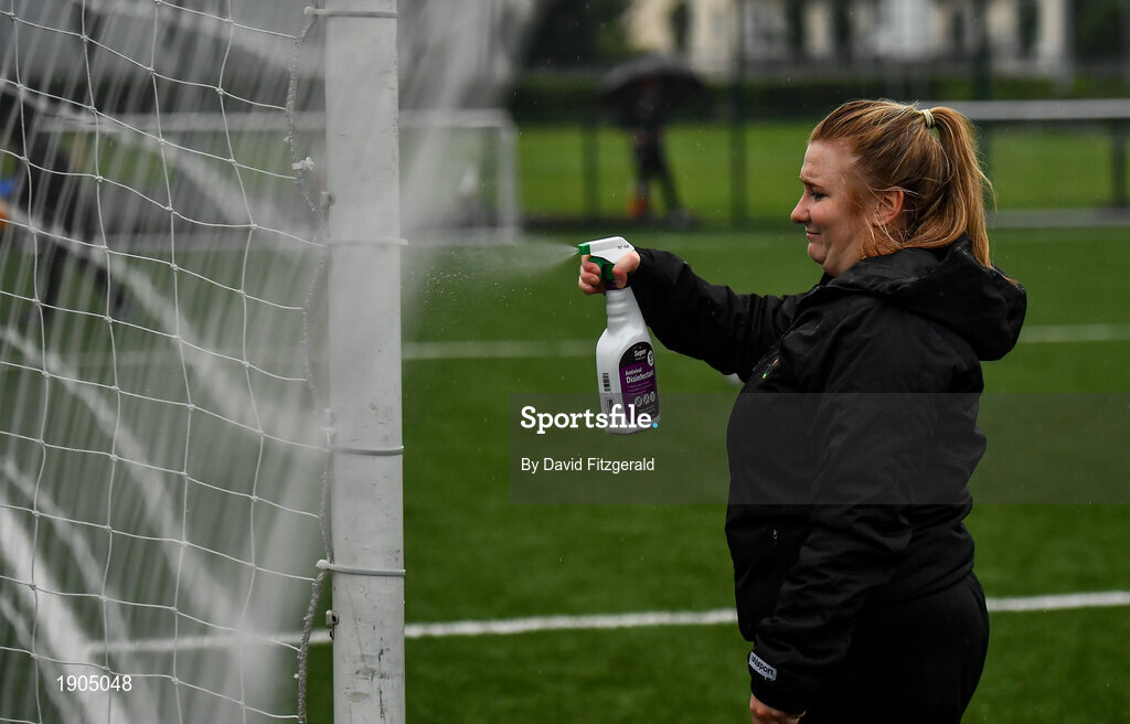 19 June 2020; Coach Emma Donohoe sanitzes the goalposts prior to a Peamount United squad training session in Greenogue in Newcastle, Dublin. Following approval from the Football Association of Ireland and the Irish Government, a number of national league teams have been allowed to resume collective training. On March 12, the FAI announced the cessation of all football under their jurisdiction upon directives from the Irish Government, the Department of Health and UEFA, in an effort to contain the spread of the Coronavirus (COVID-19) pandemic. Photo by David Fitzgerald/Sportsfile
