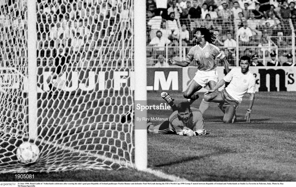 21 June 1990; Ruud Gullit of  Netherlands celebrates after scoring his side's goal past Republic of Ireland goalkeeper Packie Bonner and defender Paul McGrath during the FIFA World Cup 1990 Group F match between Republic of Ireland and Netherlands at Stadio La Favorita in Palermo, Italy. Photo by Ray McManus/Sportsfile