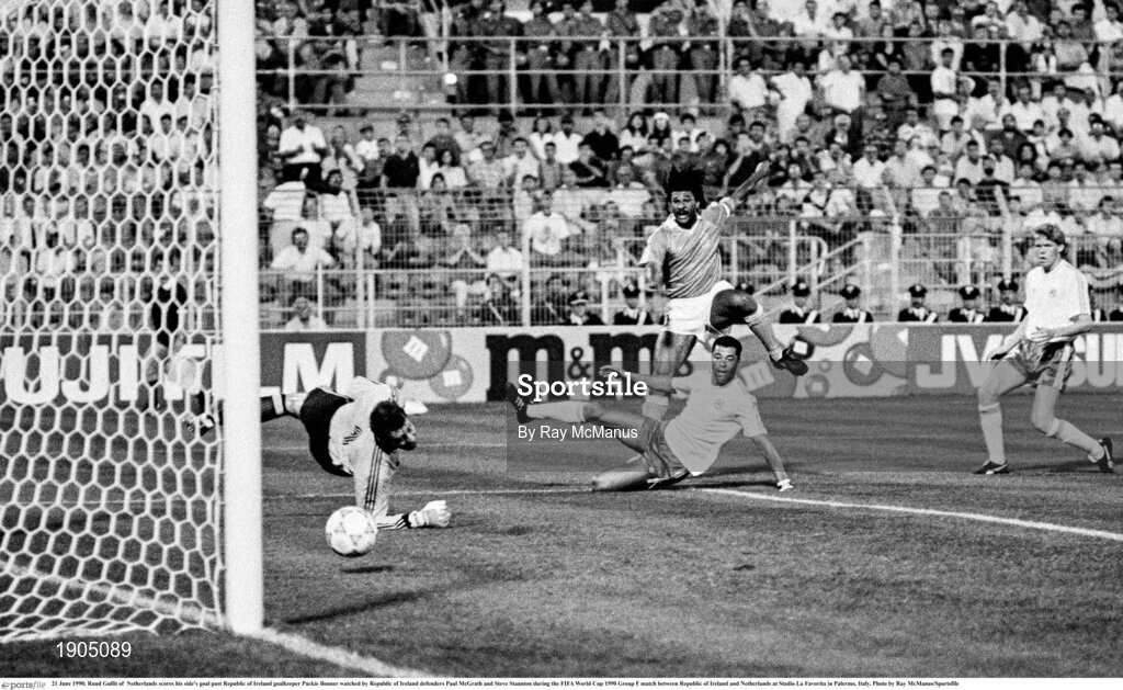 21 June 1990; Ruud Gullit of  Netherlands scores his side's goal past Republic of Ireland goalkeeper Packie Bonner watched by Republic of Ireland defenders Paul McGrath and Steve Staunton during the FIFA World Cup 1990 Group F match between Republic of Ireland and Netherlands at Stadio La Favorita in Palermo, Italy. Photo by Ray McManus/Sportsfile