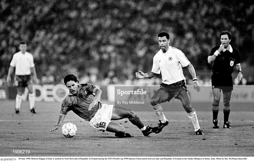 30 June 1990; Roberto Baggio of Italy is tackled by Paul McGrath of Republic of Ireland during the FIFA World Cup 1990 Quarter-Final match between Italy and Republic of Ireland at the Stadio Olimpico in Rome, Italy. Photo by Ray McManus/Sportsfile