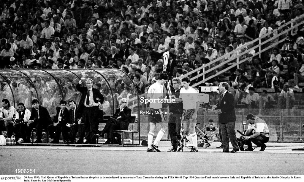 30 June 1990; Niall Quinn of Republic of Ireland leaves the pitch to be substituted by team-mate Tony Cascarino during the FIFA World Cup 1990 Quarter-Final match between Italy and Republic of Ireland at the Stadio Olimpico in Rome, Italy. Photo by Ray McManus/Sportsfile