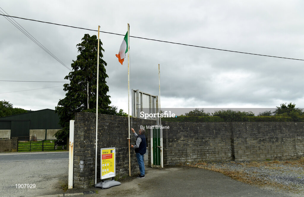 17 July 2020; Baltinglass groundsman Brendan O'Neill raise the Irish tricolour before the Wicklow County Senior Football Championship Round 1 match between Tinahely and Kiltegan at Baltinglass GAA Club in Baltinglass, Wicklow. Competitive GAA matches have been approved to return following the guidelines of Phase 3 of the Irish Government’s Roadmap for Reopening of Society and Business and protocols set down by the GAA governing authorities. With games having been suspended since March, competitive games can take place with updated protocols including a limit of 200 individuals at any one outdoor event, including players, officials and a limited number of spectators, with social distancing, hand sanitisation and face masks being worn by those in attendance among other measures in an effort to contain the spread of the Coronavirus (COVID-19) pandemic. Photo by Matt Browne/Sportsfile