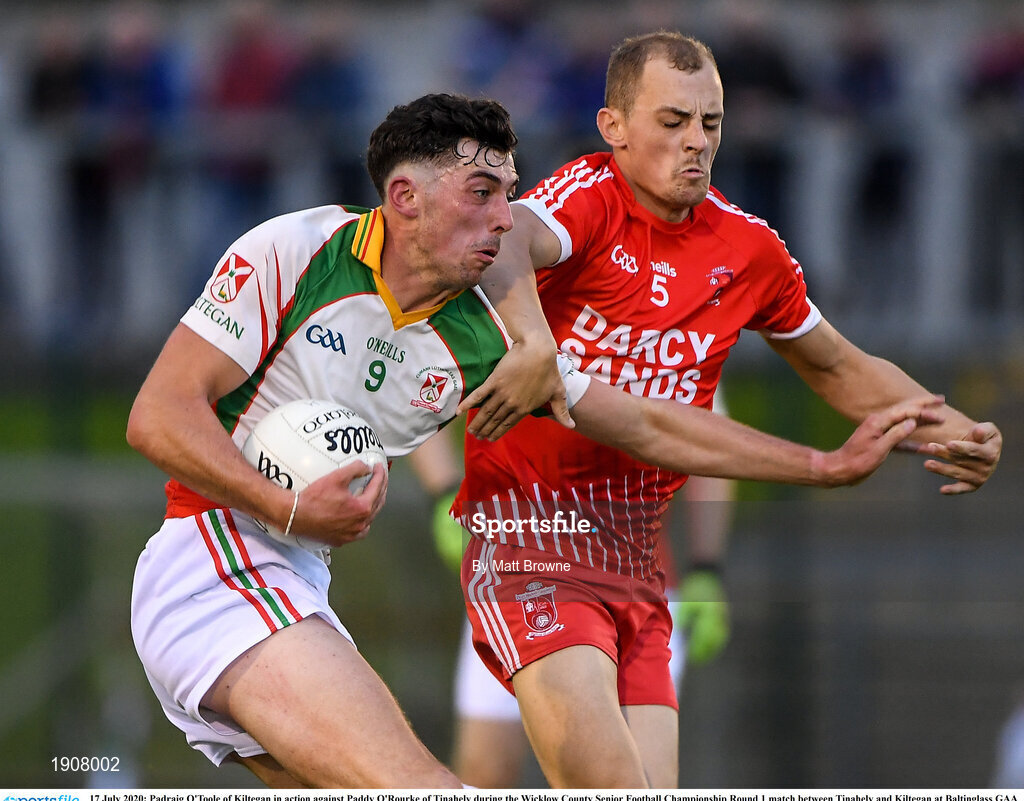 17 July 2020; Padraig O'Toole of Kiltegan in action against Paddy O'Rourke of Tinahely during the Wicklow County Senior Football Championship Round 1 match between Tinahely and Kiltegan at Baltinglass GAA Club in Baltinglass, Wicklow. Competitive GAA matches have been approved to return following the guidelines of Phase 3 of the Irish Government’s Roadmap for Reopening of Society and Business and protocols set down by the GAA governing authorities. With games having been suspended since March, competitive games can take place with updated protocols including a limit of 200 individuals at any one outdoor event, including players, officials and a limited number of spectators, with social distancing, hand sanitisation and face masks being worn by those in attendance among other measures in an effort to contain the spread of the Coronavirus (COVID-19) pandemic. Photo by Matt Browne/Sportsfile