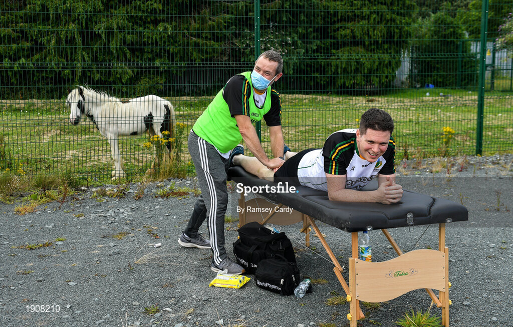 18 July 2020; John O'Riordan of Thomas Davis receives treatment from team physio Carl O'Toole ahead of the Dublin County Senior Hurling Championship Group 4 Round 1 match between Cuala and Thomas Davis at Bray Emmets GAA club in Bray, Wicklow. Competitive GAA matches have been approved to return following the guidelines of Phase 3 of the Irish Government’s Roadmap for Reopening of Society and Business and protocols set down by the GAA governing authorities. With games having been suspended since March, competitive games can take place with updated protocols including a limit of 200 individuals at any one outdoor event, including players, officials and a limited number of spectators, with social distancing, hand sanitisation and face masks being worn by those in attendance among other measures in an effort to contain the spread of the Coronavirus (COVID-19) pandemic. Photo by Ramsey Cardy/Sportsfile