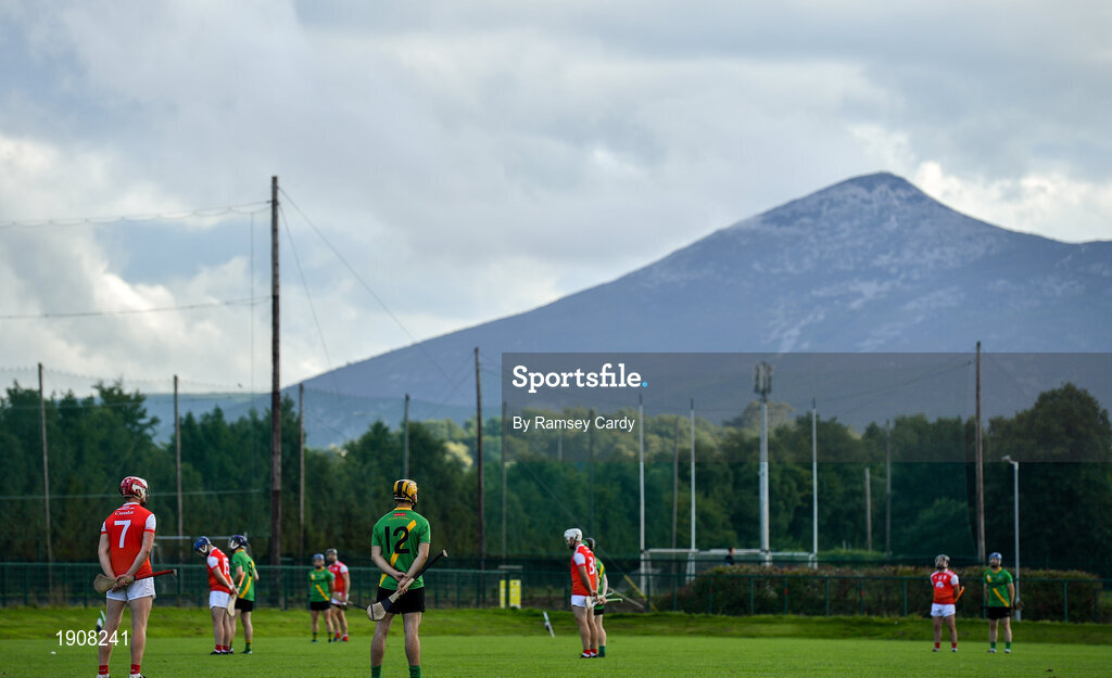18 July 2020; Players stand for a minute's silence ahead of the Dublin County Senior Hurling Championship Group 4 Round 1 match between Cuala and Thomas Davis at Bray Emmets GAA club in Bray, Wicklow. Competitive GAA matches have been approved to return following the guidelines of Phase 3 of the Irish Government’s Roadmap for Reopening of Society and Business and protocols set down by the GAA governing authorities. With games having been suspended since March, competitive games can take place with updated protocols including a limit of 200 individuals at any one outdoor event, including players, officials and a limited number of spectators, with social distancing, hand sanitisation and face masks being worn by those in attendance among other measures in an effort to contain the spread of the Coronavirus (COVID-19) pandemic. Photo by Ramsey Cardy/Sportsfile