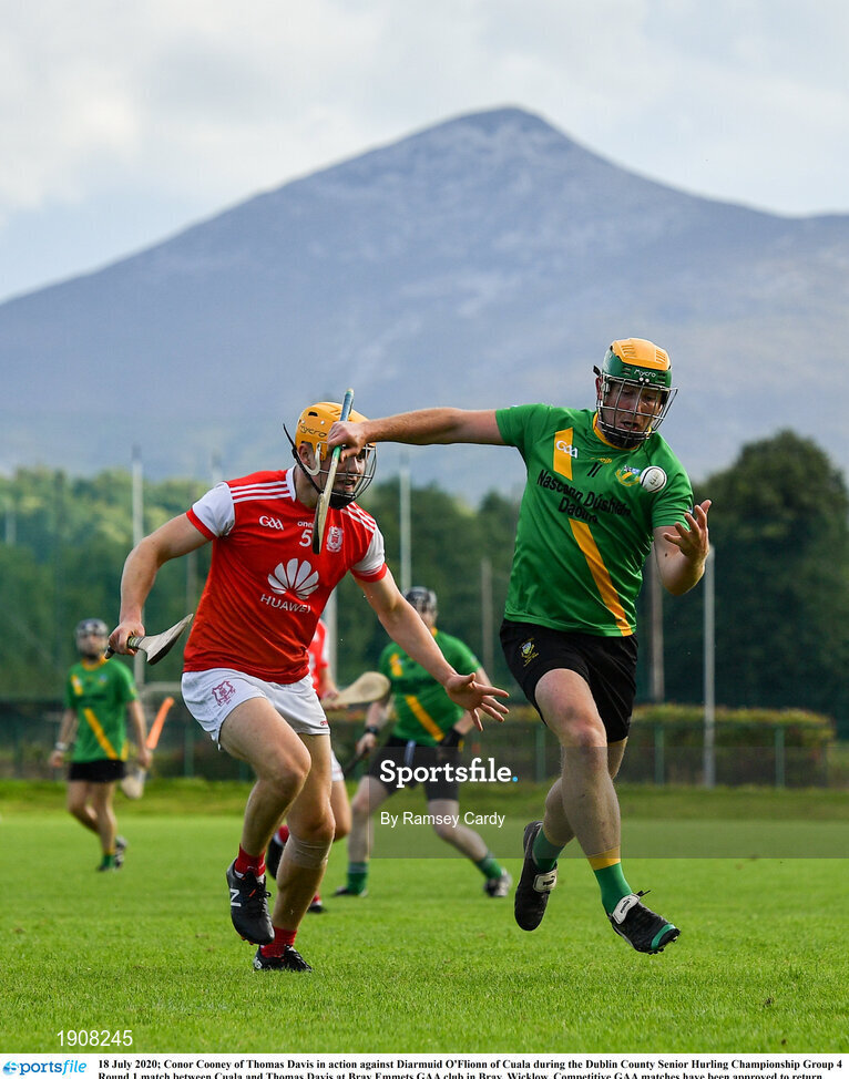 18 July 2020; Conor Cooney of Thomas Davis in action against Diarmuid O'Flionn of Cuala during the Dublin County Senior Hurling Championship Group 4 Round 1 match between Cuala and Thomas Davis at Bray Emmets GAA club in Bray, Wicklow. Competitive GAA matches have been approved to return following the guidelines of Phase 3 of the Irish Government’s Roadmap for Reopening of Society and Business and protocols set down by the GAA governing authorities. With games having been suspended since March, competitive games can take place with updated protocols including a limit of 200 individuals at any one outdoor event, including players, officials and a limited number of spectators, with social distancing, hand sanitisation and face masks being worn by those in attendance among other measures in an effort to contain the spread of the Coronavirus (COVID-19) pandemic. Photo by Ramsey Cardy/Sportsfile
