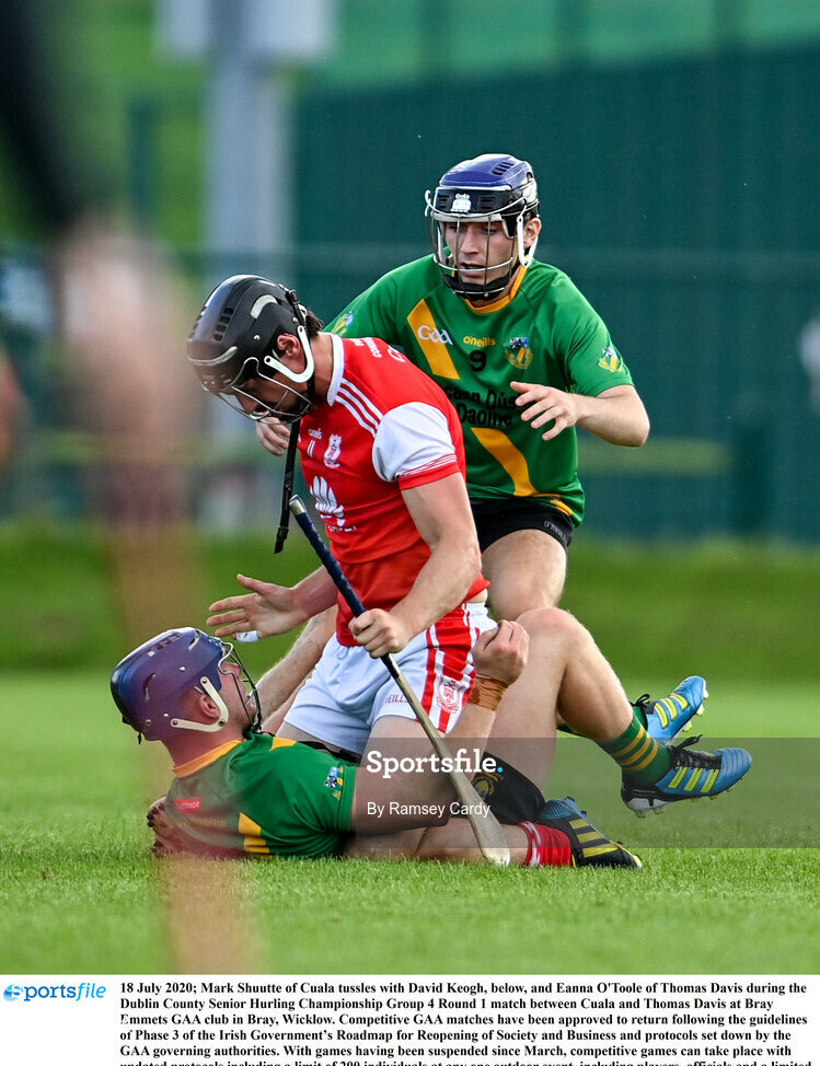 18 July 2020; Mark Shuutte of Cuala tussles with David Keogh, below, and Eanna O'Toole of Thomas Davis during the Dublin County Senior Hurling Championship Group 4 Round 1 match between Cuala and Thomas Davis at Bray Emmets GAA club in Bray, Wicklow. Competitive GAA matches have been approved to return following the guidelines of Phase 3 of the Irish Government’s Roadmap for Reopening of Society and Business and protocols set down by the GAA governing authorities. With games having been suspended since March, competitive games can take place with updated protocols including a limit of 200 individuals at any one outdoor event, including players, officials and a limited number of spectators, with social distancing, hand sanitisation and face masks being worn by those in attendance among other measures in an effort to contain the spread of the Coronavirus (COVID-19) pandemic. Photo by Ramsey Cardy/Sportsfile
