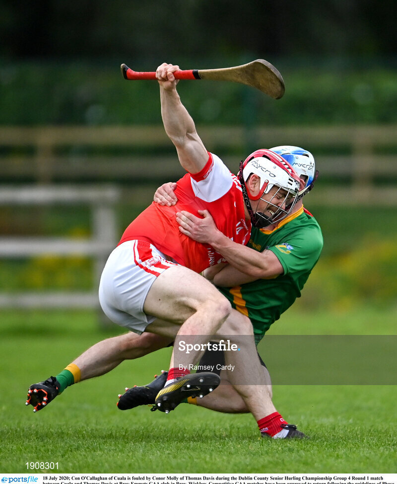 18 July 2020; Con O'Callaghan of Cuala is fouled by Conor Molly of Thomas Davis during the Dublin County Senior Hurling Championship Group 4 Round 1 match between Cuala and Thomas Davis at Bray Emmets GAA club in Bray, Wicklow. Competitive GAA matches have been approved to return following the guidelines of Phase 3 of the Irish Government’s Roadmap for Reopening of Society and Business and protocols set down by the GAA governing authorities. With games having been suspended since March, competitive games can take place with updated protocols including a limit of 200 individuals at any one outdoor event, including players, officials and a limited number of spectators, with social distancing, hand sanitisation and face masks being worn by those in attendance among other measures in an effort to contain the spread of the Coronavirus (COVID-19) pandemic. Photo by Ramsey Cardy/Sportsfile