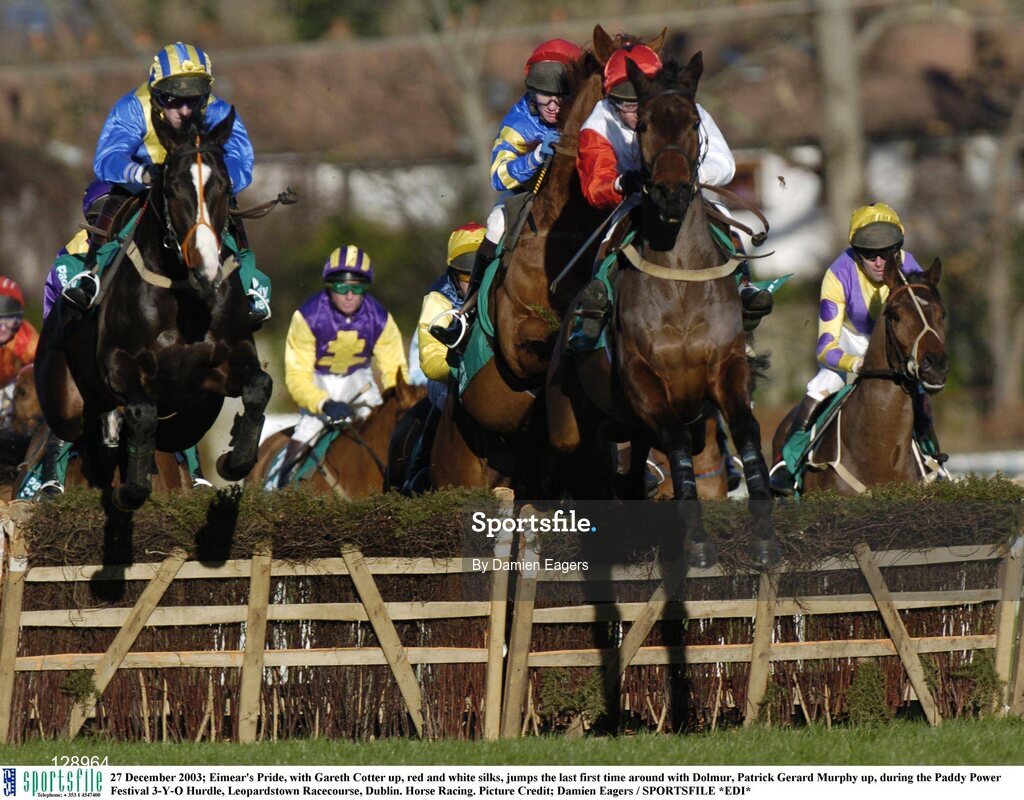 27 December 2003; Eimear's Pride, with Gareth Cotter up, red and white silks, jumps the last first time around with Dolmur, Patrick Gerard Murphy up, during the Paddy Power Festival 3-Y-O Hurdle, Leopardstown Racecourse, Dublin. Horse Racing. Picture Credit; Damien Eagers / SPORTSFILE *EDI*