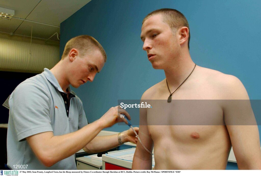 27 May 2002; Sean Prunty, Longford Town, has his Bicep measured by Fitness Co-ordinator Daragh Sheridan at DCU, Dublin. Picture credit; Ray McManus / SPORTSFILE *EDI*