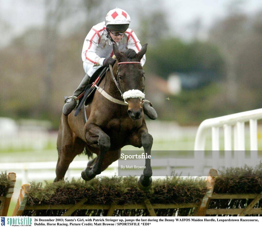 26 December 2003; Santa's Girl, with Patrick Stringer up, jumps the last during the Denny WAIFOS Maiden Hurdle, Leopardstown Racecourse, Dublin. Horse Racing. Picture Credit; Matt Browne / SPORTSFILE *EDI*