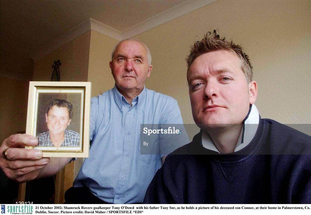 21 October 2002; Shamrock Rovers goalkeeper Tony O'Dowd  with his father Tony Snr, as he holds a picture of his deceased son Connor, at their home in Palmerstown, Co. Dublin. Soccer. Picture credit; David Maher / SPORTSFILE *EDI*