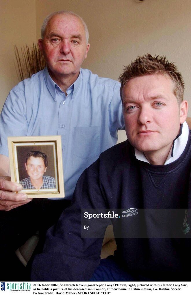 21 October 2002; Shamrock Rovers goalkeeper Tony O'Dowd, right, pictured with his father Tony Snr, as he holds a picture of his deceased son Connor, at their home in Palmerstown, Co. Dublin. Soccer. Picture credit; David Maher / SPORTSFILE *EDI*