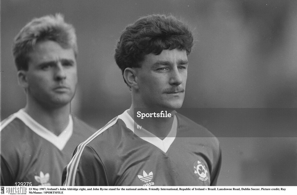 23 May 1987; Ireland's John Aldridge right, and John Byrne stand for the national anthem. Friendly International, Republic of Ireland v Brazil. Lansdowne Road, Dublin Soccer. Picture credit; Ray McManus / SPORTSFILE