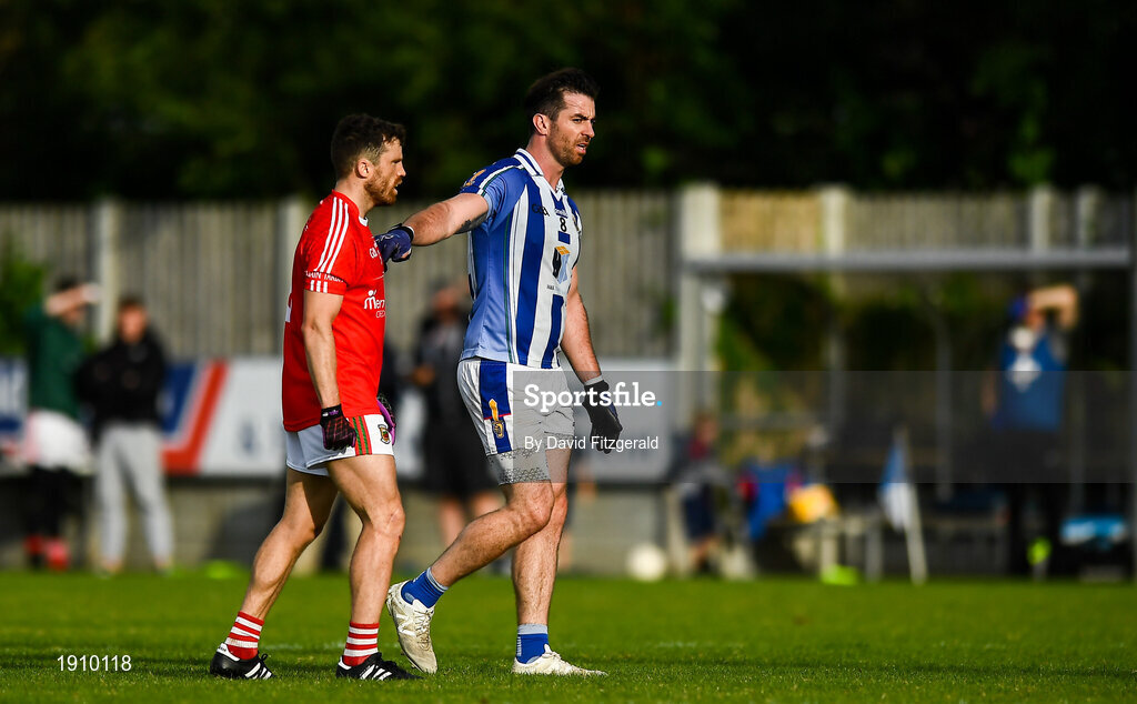 25 July 2020; Michael Darragh Macauley of Ballyboden St Enda's and Chris Barrett of Clontarf during the Dublin County Senior Football Championship Round 1 match between Ballyboden St Endas and Clontarf at Pairc Uí Mhurchu in Dublin. GAA matches continue to take place in front of a limited number of people in an effort to contain the spread of the Coronavirus (COVID-19) pandemic. Photo by David Fitzgerald/Sportsfile